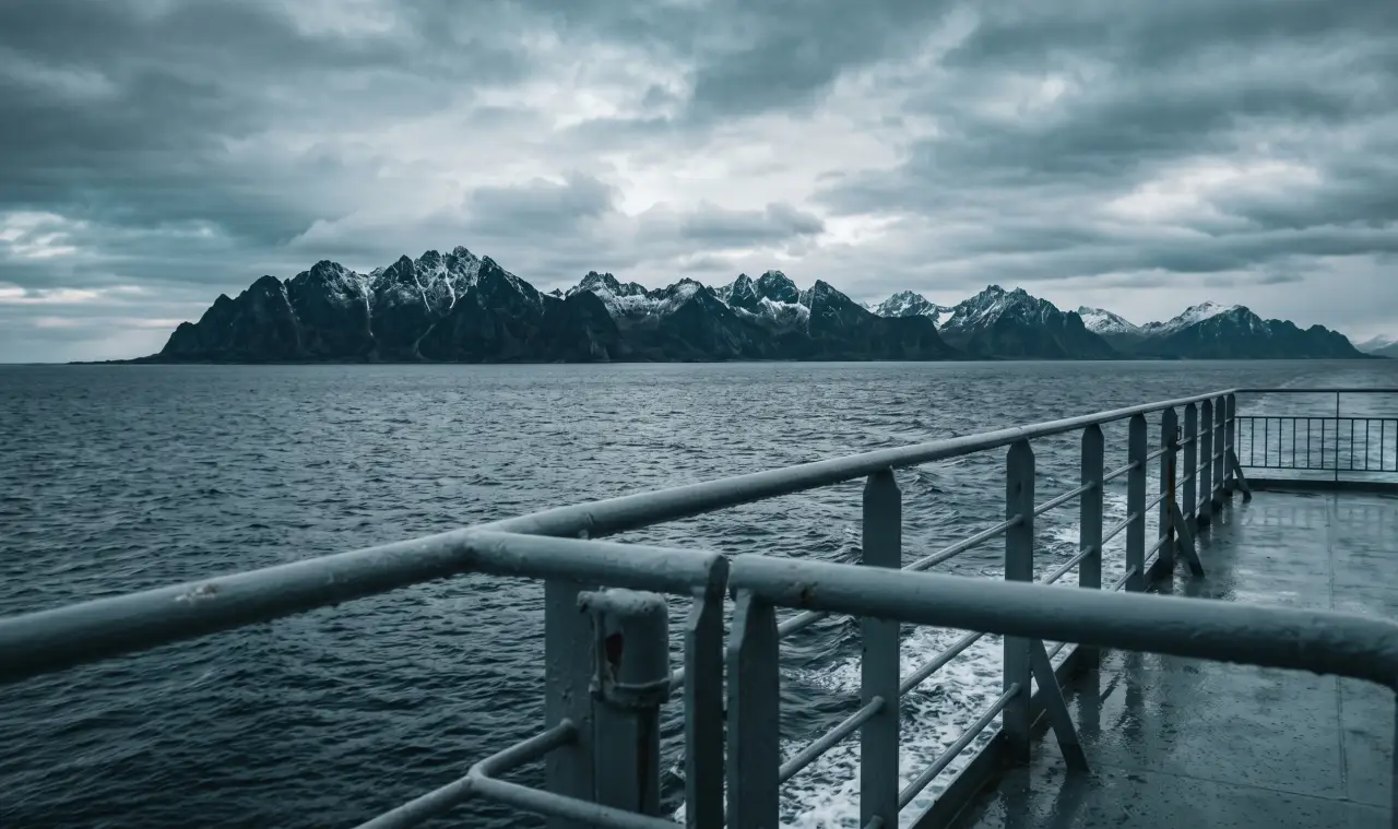 Ferry crossing the Vestfjord towards the Lofoten Islands with mountain silhouettes on the horizon