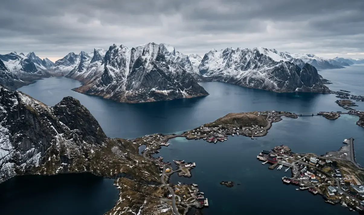 Panoramic view of the Lofoten Islands, Norway — jagged mountain peaks rising from the Arctic sea